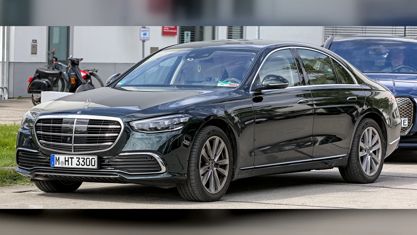 Black Mercedes-Benz S-Class W223 sedan, front three-quarter view, parked outside